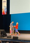 Photo of the BAUS ASM 2024 - Jo Cresswell presenting Prof Ian Pearce with the BAUS Presidential Medal.